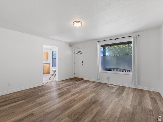 963 E 23rd St, Ogden, UT 84401 - empty room with wood finished floors and baseboards