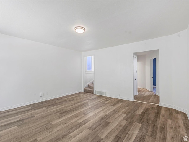 963 E 23rd St, Ogden, UT 84401 - spare room featuring wood finished floors and stairway