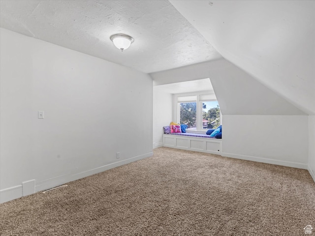 963 E 23rd St, Ogden, UT 84401 - bonus room with vaulted ceiling, light colored carpet, and a textured ceiling