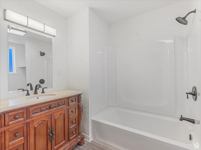 963 E 23rd St, Ogden, UT 84401 - full bath featuring vanity, shower / tub combination, and wood finished floors