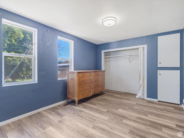 963 E 23rd St, Ogden, UT 84401 - bedroom featuring light wood-style floors, multiple windows, and a closet