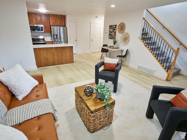 257 N 900 W, Provo, UT 84601 - living area featuring light wood finished floors and stairway