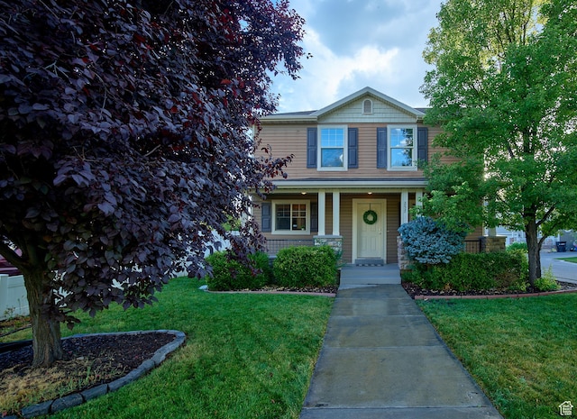 257 N 900 W, Provo, UT 84601 - traditional-style house with a front yard and a porch