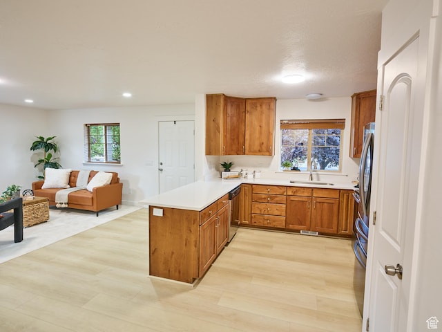 257 N 900 W, Provo, UT 84601 - kitchen with a peninsula, brown cabinets, stainless steel dishwasher, light countertops, and open floor plan