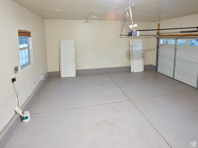 257 N 900 W, Provo, UT 84601 - garage featuring a garage door opener and baseboards