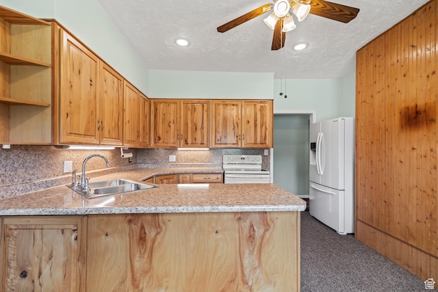 407 E 200 N, Richfield, UT 84701 - kitchen with white appliances, a peninsula, dark carpet, backsplash, and a ceiling fan