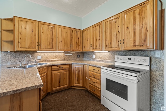 407 E 200 N, Richfield, UT 84701 - kitchen with electric range, decorative backsplash, light countertops, brown cabinets, and ornamental molding