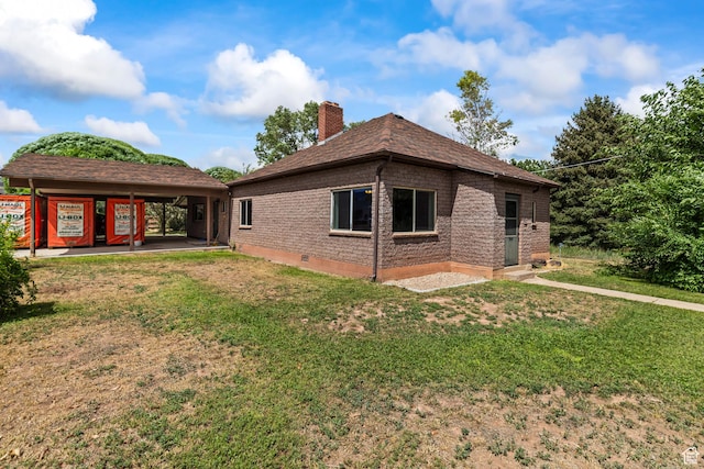 407 E 200 N, Richfield, UT 84701 - back of property with a chimney, a lawn, and brick siding