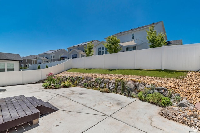 2123 N Wallflower Dr, Saratoga Springs, UT 84045 - fenced backyard with a residential view and a patio area