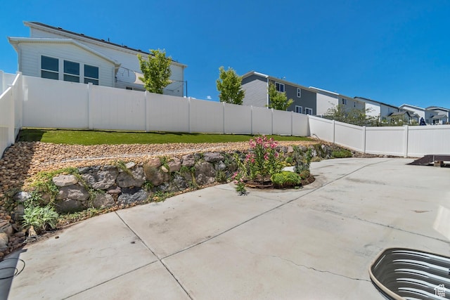 2123 N Wallflower Dr, Saratoga Springs, UT 84045 - fenced backyard with a patio area