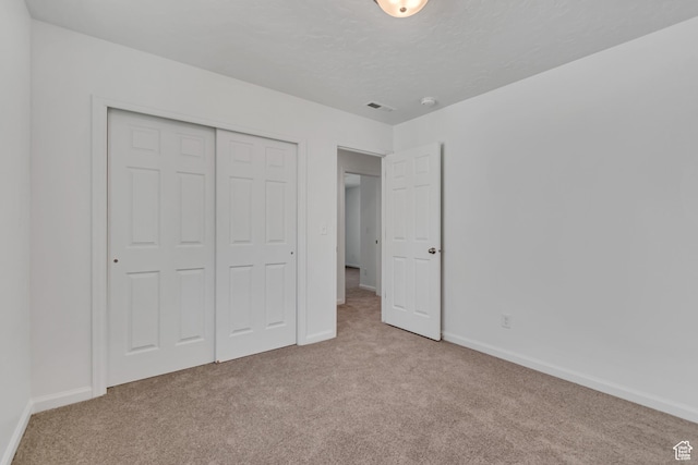 2123 N Wallflower Dr, Saratoga Springs, UT 84045 - unfurnished bedroom with carpet flooring, a closet, and a textured ceiling