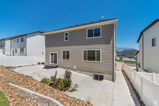 2123 N Wallflower Dr, Saratoga Springs, UT 84045 - rear view of house with a patio area, a fenced backyard, a residential view, and entry steps