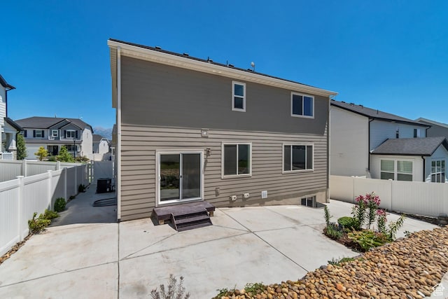 2123 N Wallflower Dr, Saratoga Springs, UT 84045 - back of property with a patio area, a fenced backyard, and a residential view