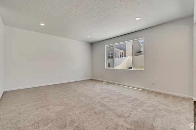 2123 N Wallflower Dr, Saratoga Springs, UT 84045 - carpeted spare room with a textured ceiling and recessed lighting