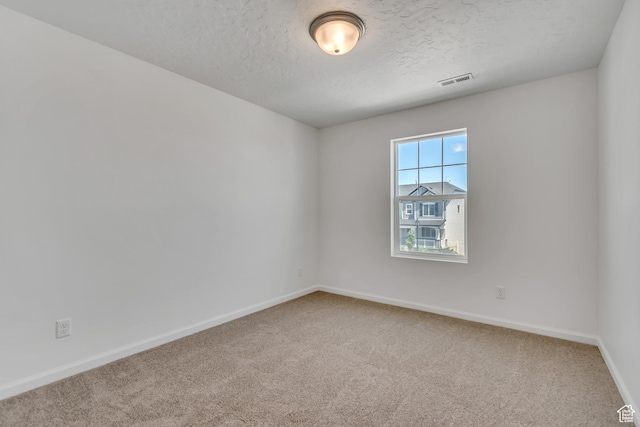 2123 N Wallflower Dr, Saratoga Springs, UT 84045 - carpeted spare room featuring a textured ceiling and baseboards