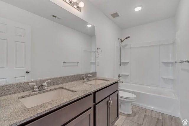 2123 N Wallflower Dr, Saratoga Springs, UT 84045 - bathroom featuring double vanity, shower / bathtub combination, and recessed lighting