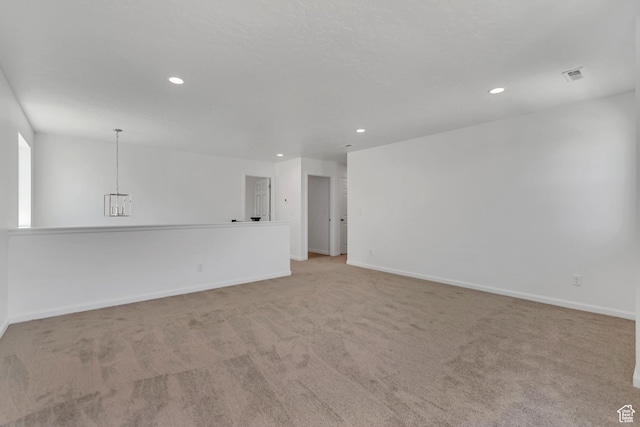 2123 N Wallflower Dr, Saratoga Springs, UT 84045 - empty room with carpet, recessed lighting, and a chandelier