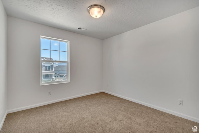 2123 N Wallflower Dr, Saratoga Springs, UT 84045 - carpeted empty room featuring baseboards and a textured ceiling