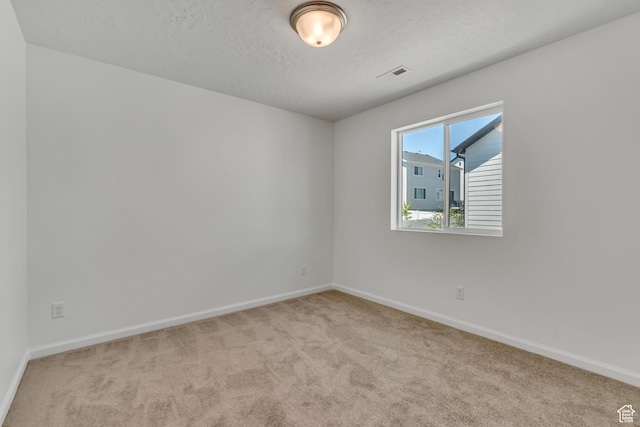 2123 N Wallflower Dr, Saratoga Springs, UT 84045 - spare room featuring carpet flooring and a textured ceiling
