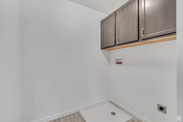 2123 N Wallflower Dr, Saratoga Springs, UT 84045 - laundry area featuring electric dryer hookup, cabinet space, and hookup for a washing machine