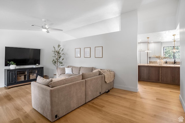 1655 Maplewood Way, St George, UT 84790 - living room with light wood-type flooring, ceiling fan, and lofted ceiling