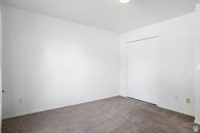 1655 Maplewood Way, St George, UT 84790 - unfurnished bedroom featuring carpet and a closet