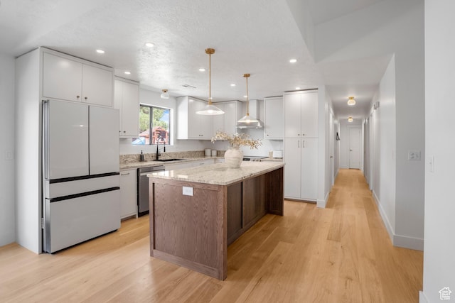 1655 Maplewood Way, St George, UT 84790 - kitchen with freestanding refrigerator, dishwasher, light wood-style flooring, a kitchen island, and recessed lighting