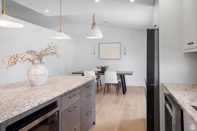 1655 Maplewood Way, St George, UT 84790 - kitchen with lofted ceiling, freestanding refrigerator, light wood finished floors, recessed lighting, and hanging light fixtures