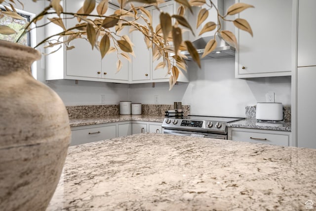1655 Maplewood Way, St George, UT 84790 - kitchen with stainless steel range with electric stovetop, light stone countertops, and white cabinets
