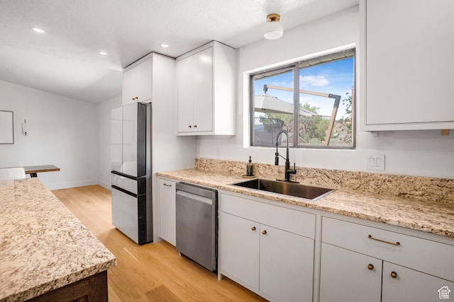 1655 Maplewood Way, St George, UT 84790 - kitchen featuring appliances with stainless steel finishes, light wood-style flooring, white cabinetry, recessed lighting, and light stone counters