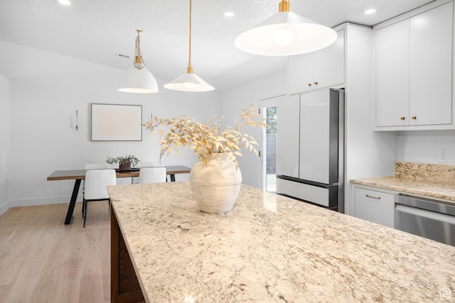 1655 Maplewood Way, St George, UT 84790 - kitchen with freestanding refrigerator, light wood-type flooring, decorative light fixtures, recessed lighting, and white cabinetry