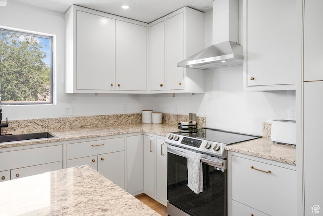 1655 Maplewood Way, St George, UT 84790 - kitchen featuring wall chimney exhaust hood, electric range, white cabinetry, and recessed lighting