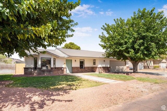 1655 Maplewood Way, St George, UT 84790 - ranch-style home with brick siding, driveway, and a garage