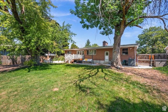 1770 E Vine St S, Salt Lake City, UT 84121 - back of property featuring brick siding, a wooden deck, and a chimney