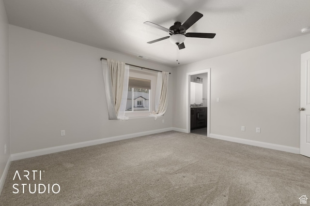 668 E Fiddlers Cove Dr Unit 35, Cedar City, UT 84721 - unfurnished bedroom with carpet floors, connected bathroom, and a ceiling fan