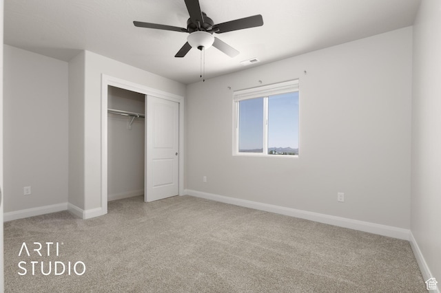 668 E Fiddlers Cove Dr Unit 35, Cedar City, UT 84721 - unfurnished bedroom featuring light carpet, a closet, and ceiling fan