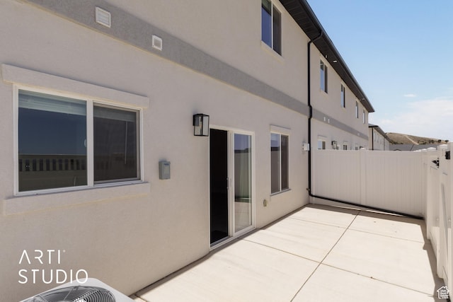 668 E Fiddlers Cove Dr Unit 35, Cedar City, UT 84721 - rear view of property featuring a patio area and stucco siding