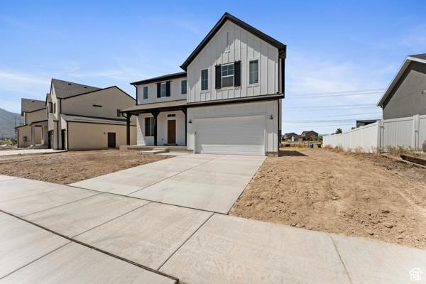 737 N Plainsman Dr Unit 108, Spanish Fork, UT 84660 - modern inspired farmhouse featuring board and batten siding, an attached garage, and concrete driveway