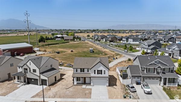 737 N Plainsman Dr Unit 108, Spanish Fork, UT 84660 - aerial view of residential area with a mountainous background