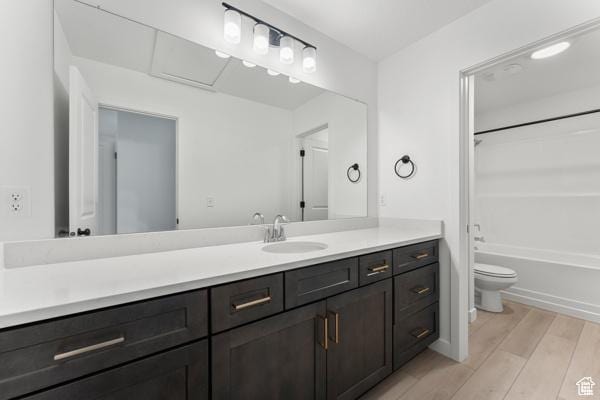 737 N Plainsman Dr Unit 108, Spanish Fork, UT 84660 - bathroom with wood finished floors, vanity, and shower / washtub combination