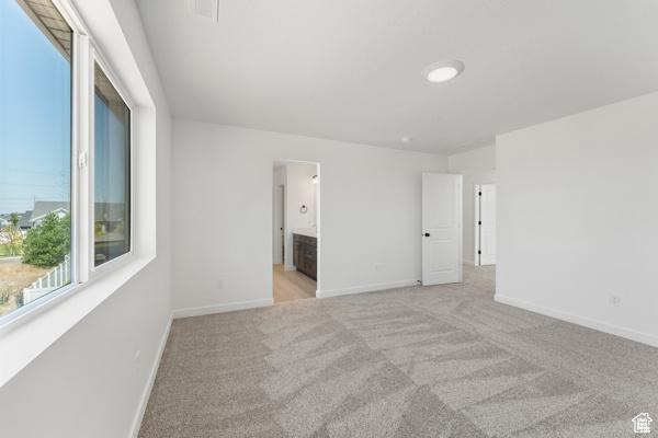 737 N Plainsman Dr Unit 108, Spanish Fork, UT 84660 - spare room featuring light carpet and a fireplace