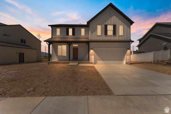 737 N Plainsman Dr Unit 108, Spanish Fork, UT 84660 - traditional home featuring driveway, an attached garage, board and batten siding, and a porch