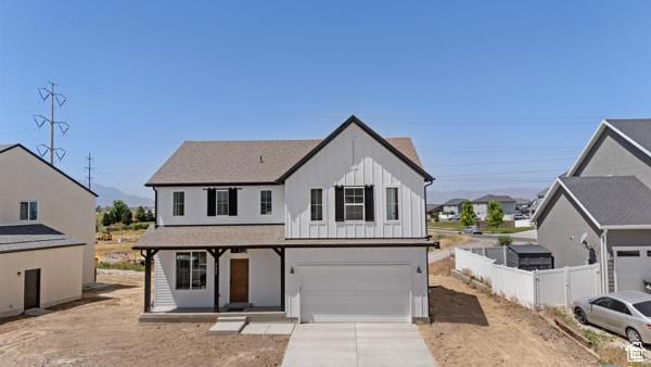 737 N Plainsman Dr Unit 108, Spanish Fork, UT 84660 - modern farmhouse style home featuring a garage, concrete driveway, board and batten siding, and a porch