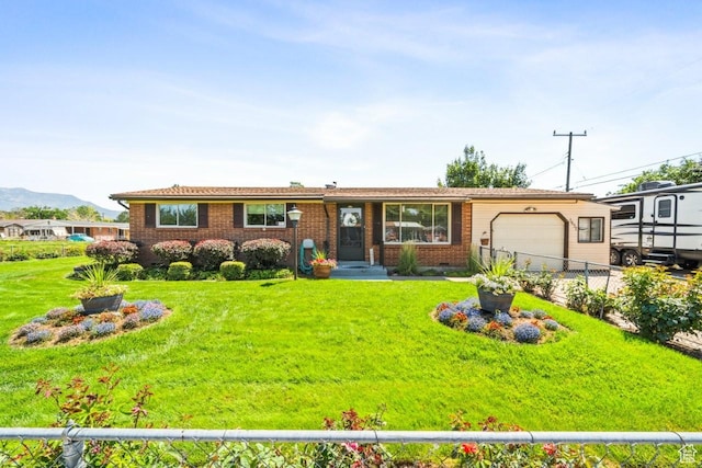 1632 Bennett St, Layton, UT 84041 - single story home with a garage, brick siding, and a mountain view