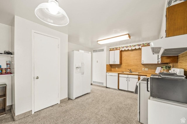 1632 Bennett St, Layton, UT 84041 - kitchen featuring white appliances, white cabinets, light countertops, tasteful backsplash, and under cabinet range hood