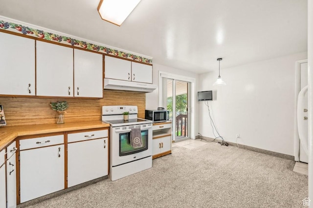 1632 Bennett St, Layton, UT 84041 - kitchen with white range with electric stovetop, under cabinet range hood, light countertops, white cabinetry, and stainless steel microwave