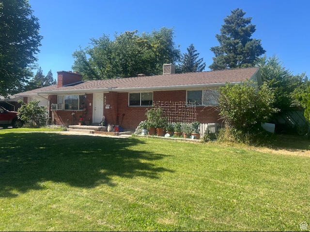 427 E 1070 S, Orem, UT 84097 - ranch-style house featuring a chimney, a front yard, and brick siding