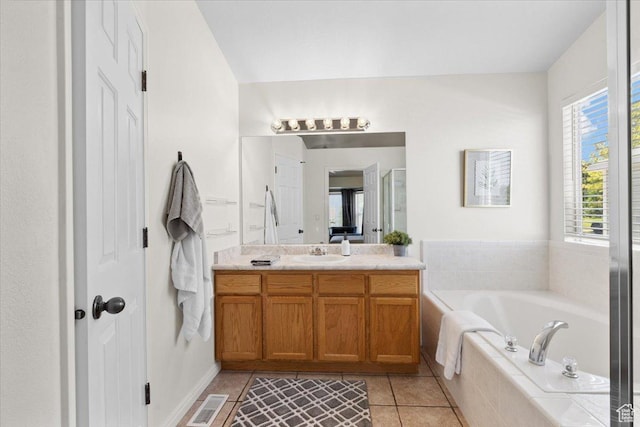 6515 S Mount Whitney Ln, West Valley City, UT 84118 - full bath with vanity, a bath, and tile patterned flooring