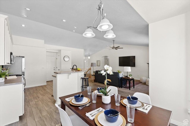 6515 S Mount Whitney Ln, West Valley City, UT 84118 - dining room with ceiling fan, lofted ceiling, light wood-style flooring, and recessed lighting