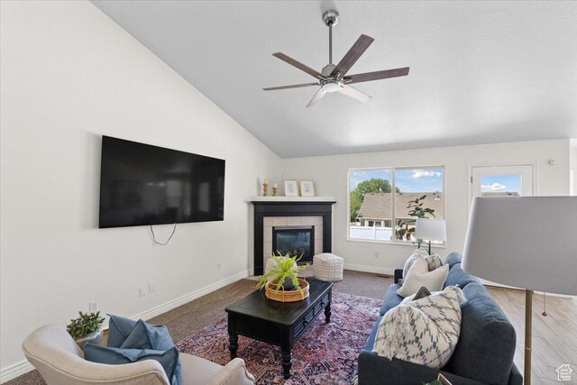 6515 S Mount Whitney Ln, West Valley City, UT 84118 - living room with a ceiling fan, vaulted ceiling, and a tile fireplace